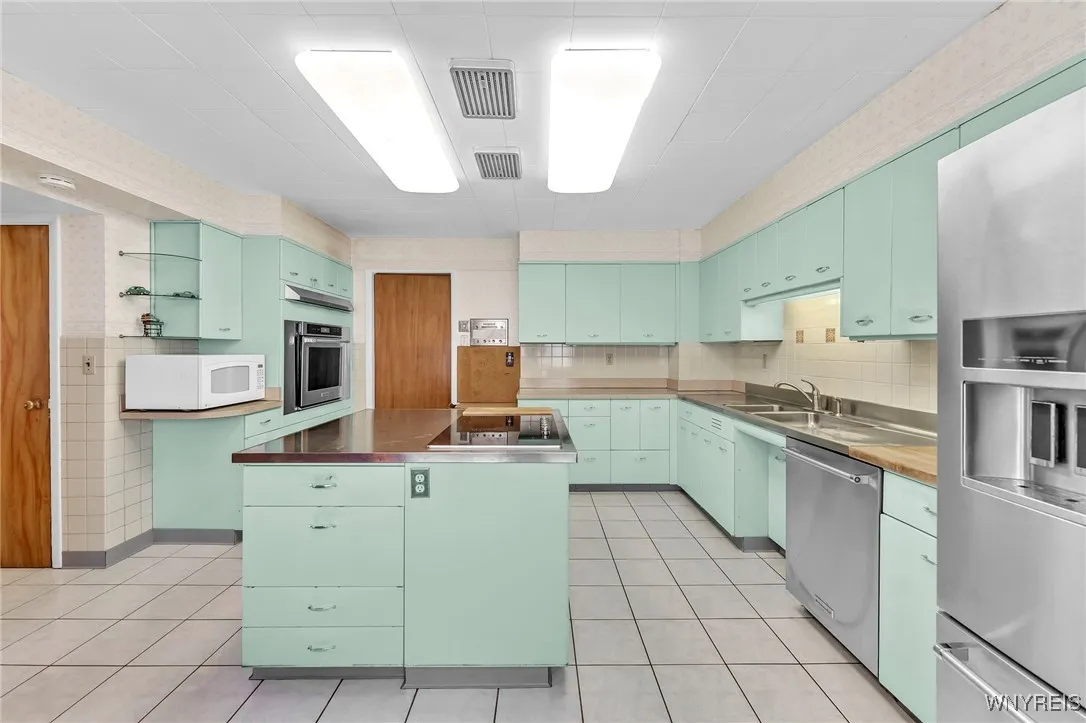 Vintage vibe with metal cabinets, stainless steel & butcherblock countertops