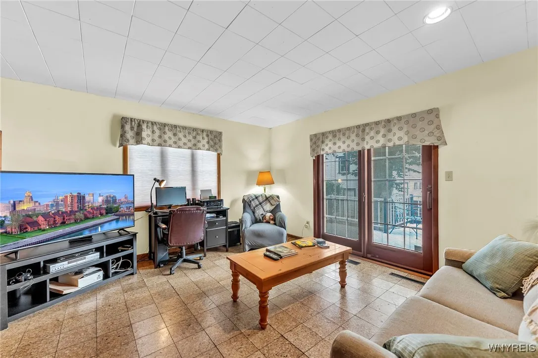 Den/office with Pella sliding doors to step out to the deck & backyard