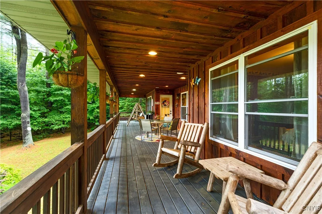 Large Wrap Around Porch Overlooking the Yard and Lake
