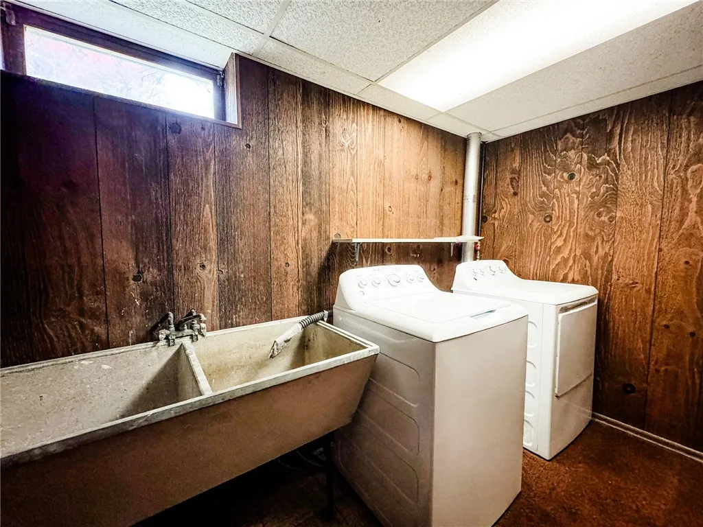 A basement laundry area boasts plenty of room.