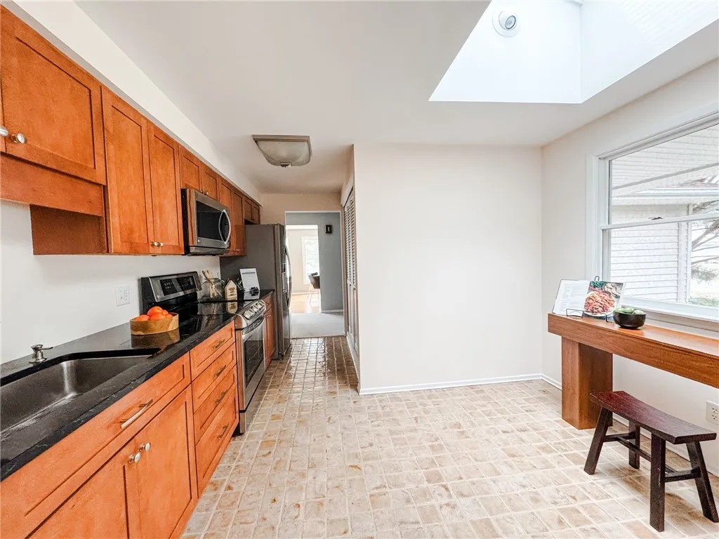 The KraftMaid kitchen offers plenty of storage and space to eat in.