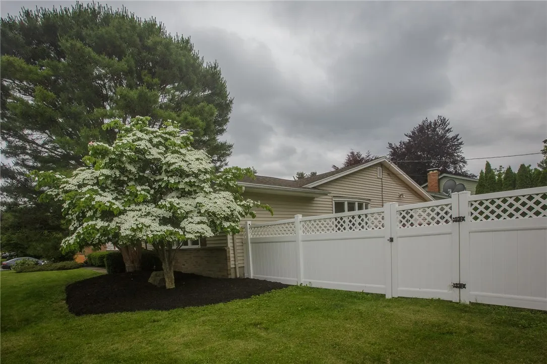 The vinyl fence provides privacy to the corner lot.