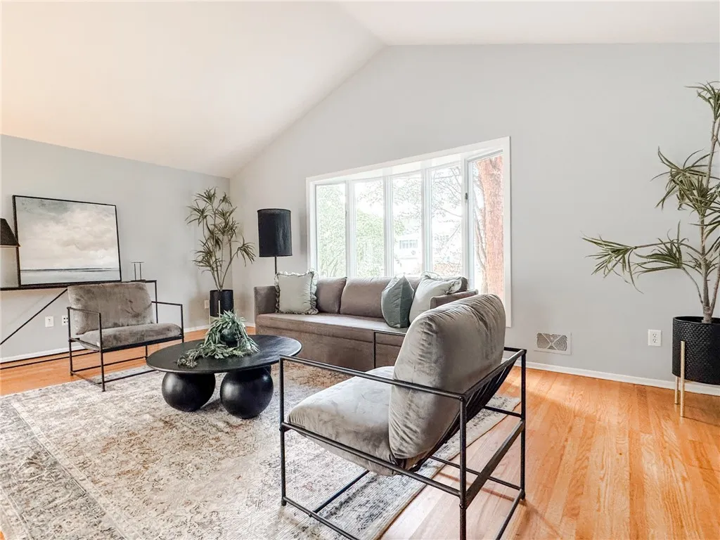 A bay window with aterritorial view graces the large living room area.