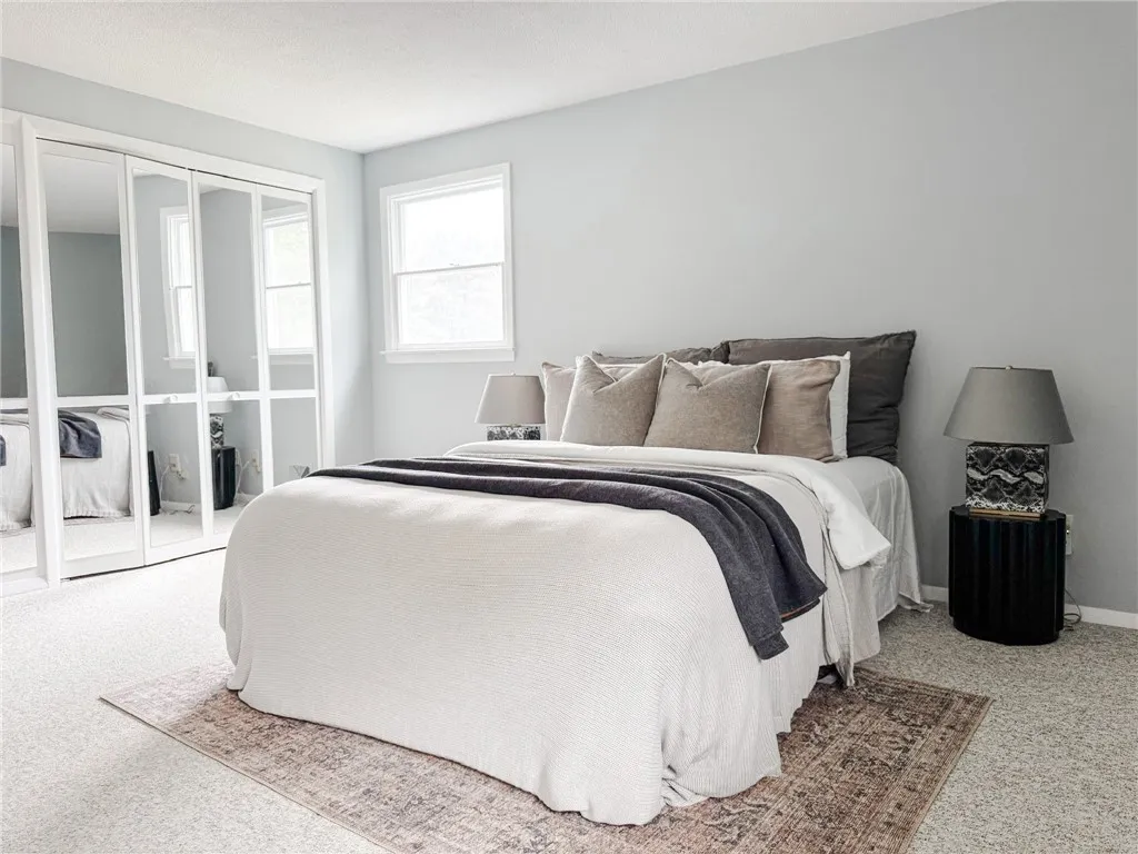 The spacious primary bedroom offers plenty of closet storage.