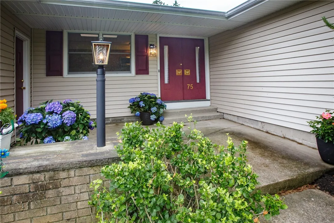 The inviting entry features a double-wide doorway.