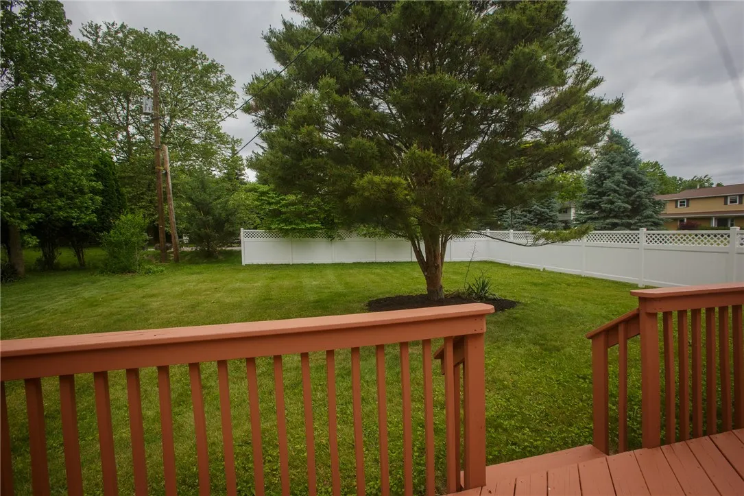 The freshly-painted deck gives way to a back yard worth of large parties.