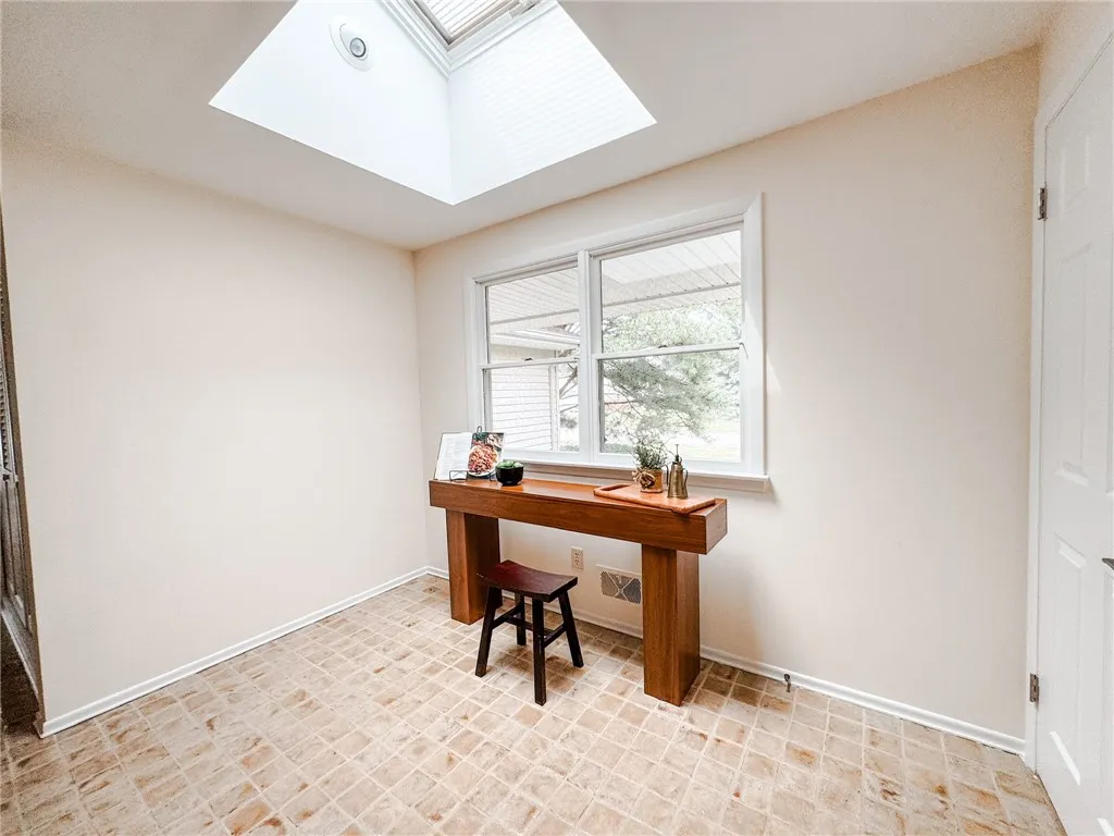 A skylight brightens the breakfast area in the kitchen.