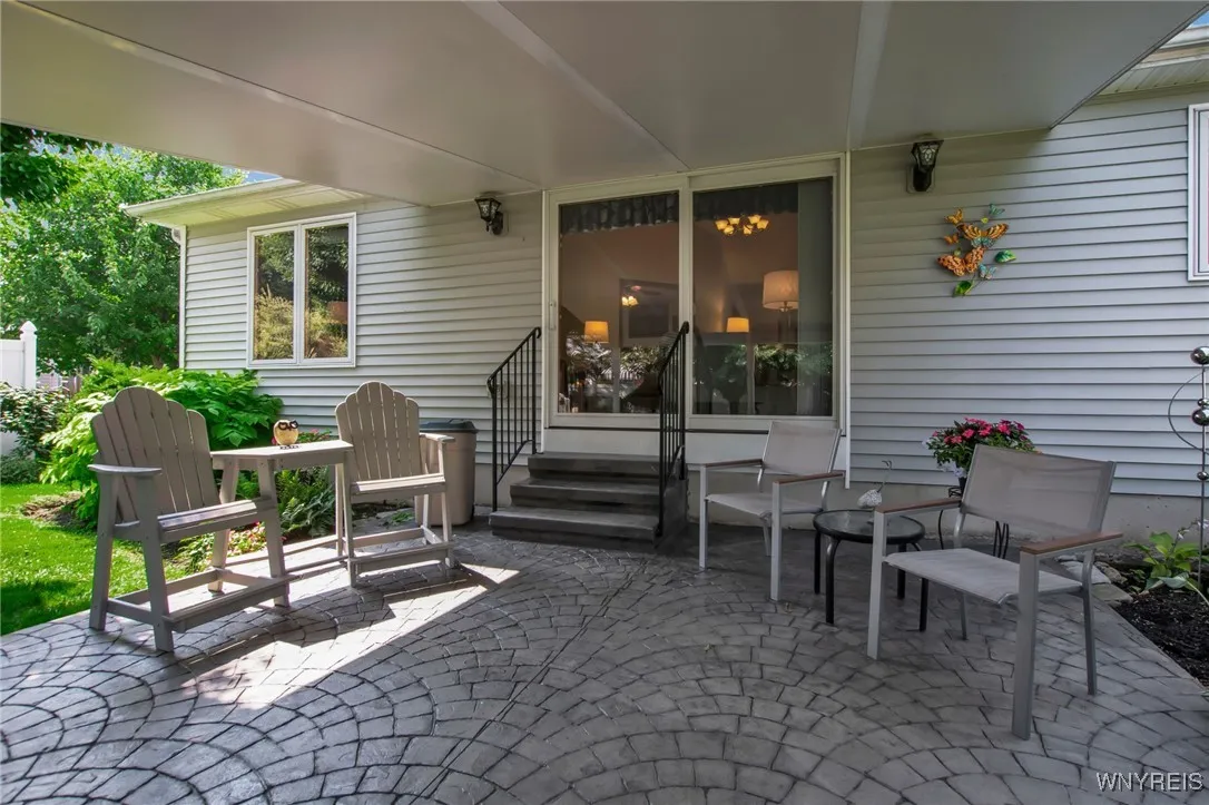 covered patio with sliding glass door to living room