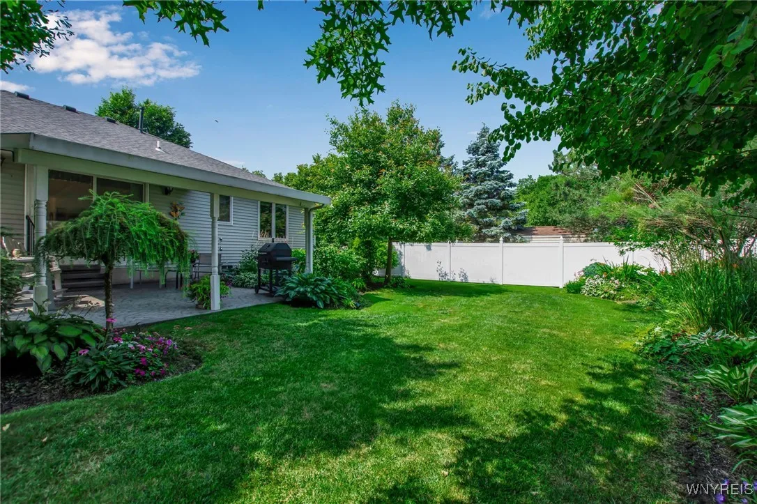 Lovely vinyl fence in backyard
