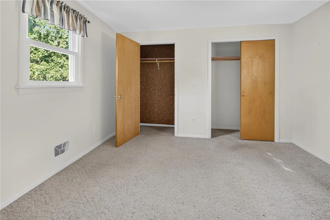 BEDROOM ON THE RIGHT AT THE TOP OF THE STAIRS. 2 CLOSETS, ONE IS CEDAR
