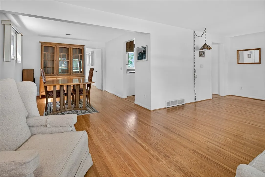 COMFORTABLE SIZED DINING AREA W/ 2 EXTENSION LEAVES THAT CAN SEAT 10  * DINING SET MAY CONVEY*  RECESSED LIGHTS ON A DIMMER SWITCH. 

