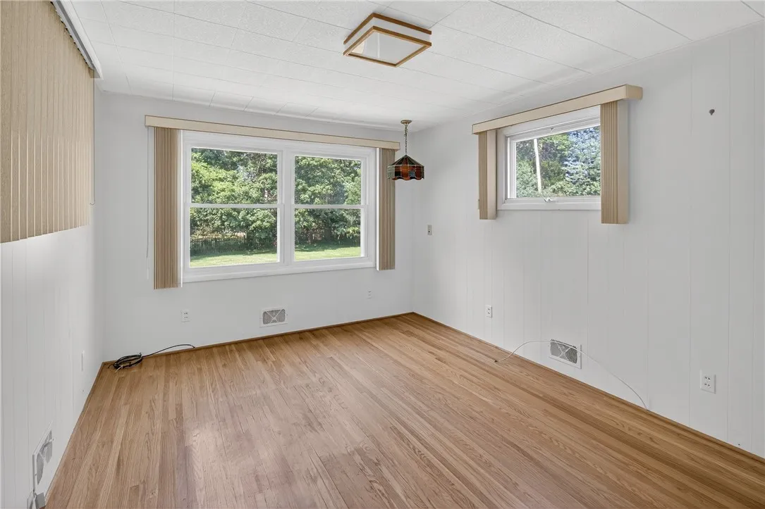 FAMILY ROOM WITH VIEW OF THE BACK YARD