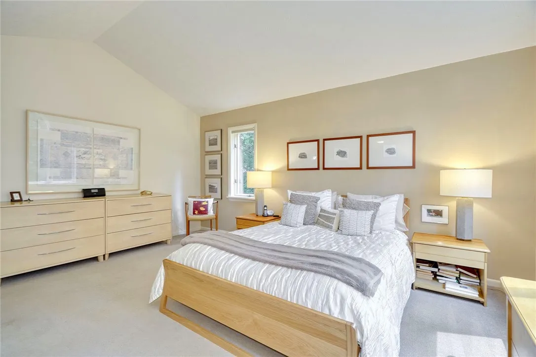 PRIMARY SUITE = WOW! Bright and Spacious with Vaulted ceilings and oversized windows!