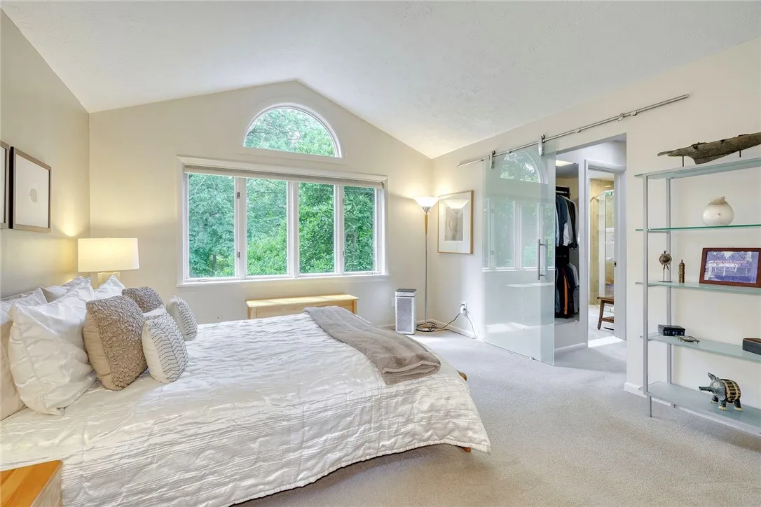 PRIMARY SUITE = WOW! Bright and Spacious with Vaulted ceilings and oversized windows!