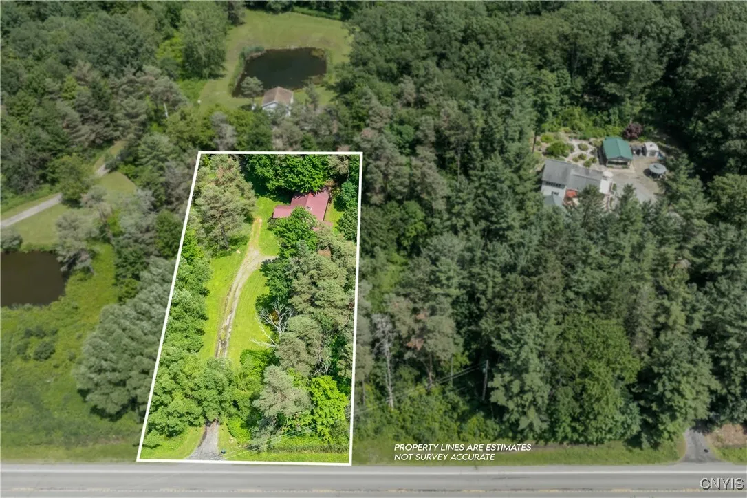Bird's eye view of the property and home. See the next photo for additional land included in the sale