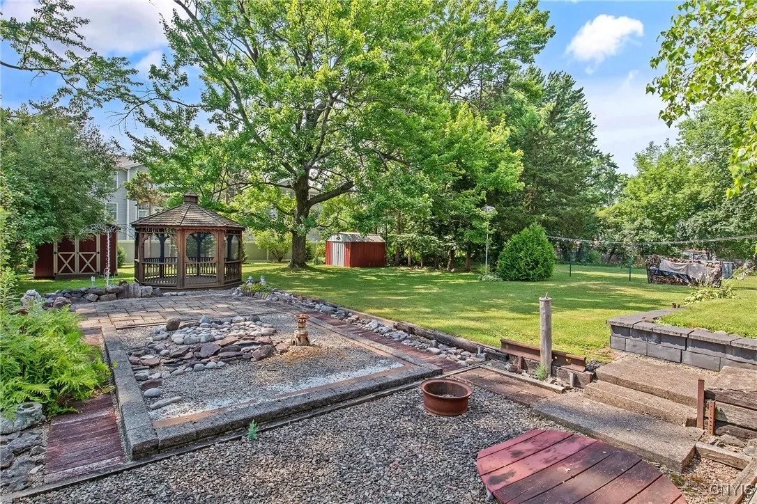 Custom built gazebo screen room, patio and rock garden