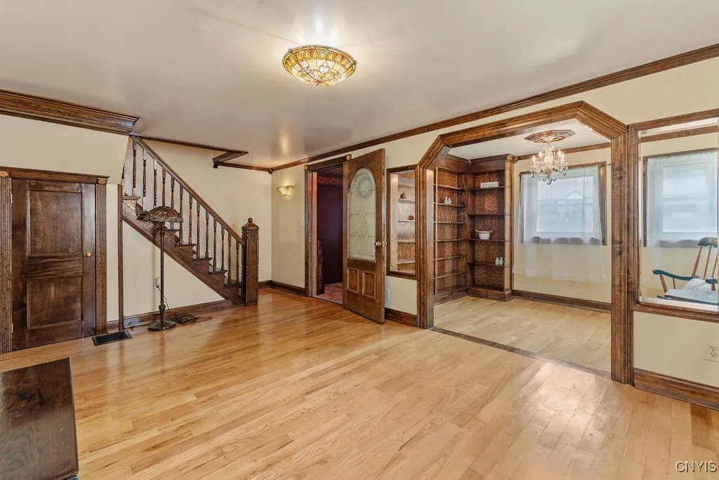 Notice the beautiful tiffany lighting and crown molding.