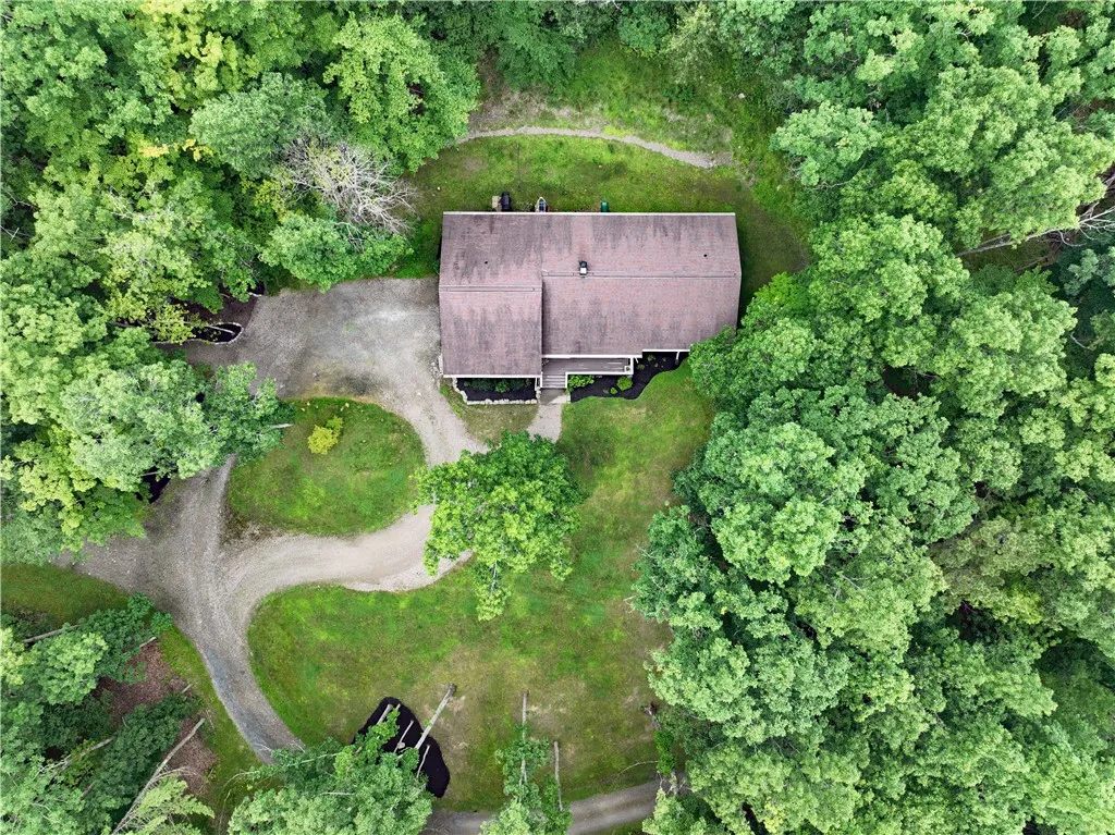 Aerial view of home and drive