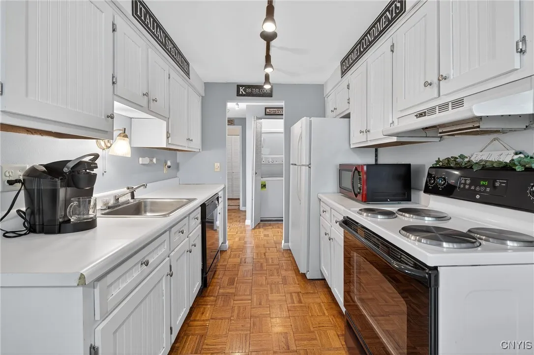 Galley kitchen, all appliances stay.
