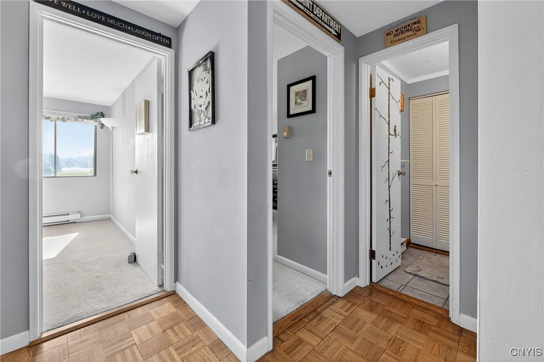 Hallway leads to bath and both bedrooms.