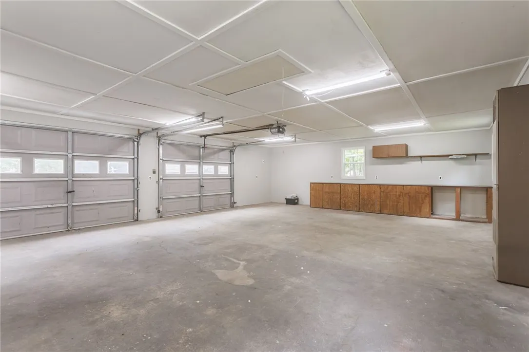 2.5 Car attached garage w/ subpanel, welder, insulated & heated.