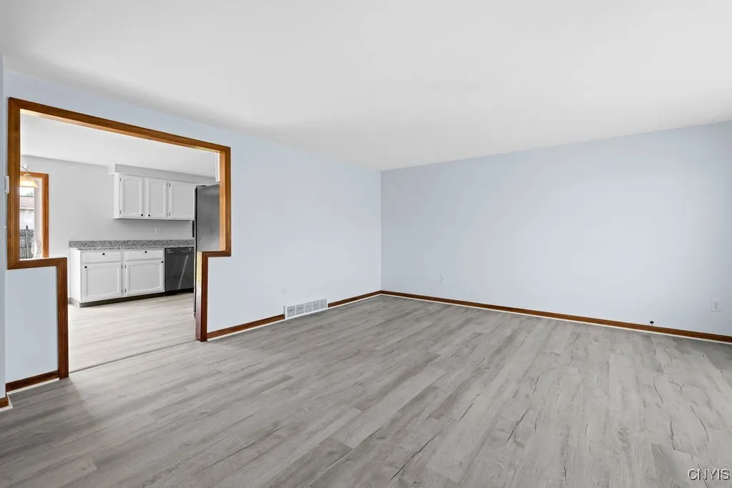 View as you enter the front door into a large bright living room.