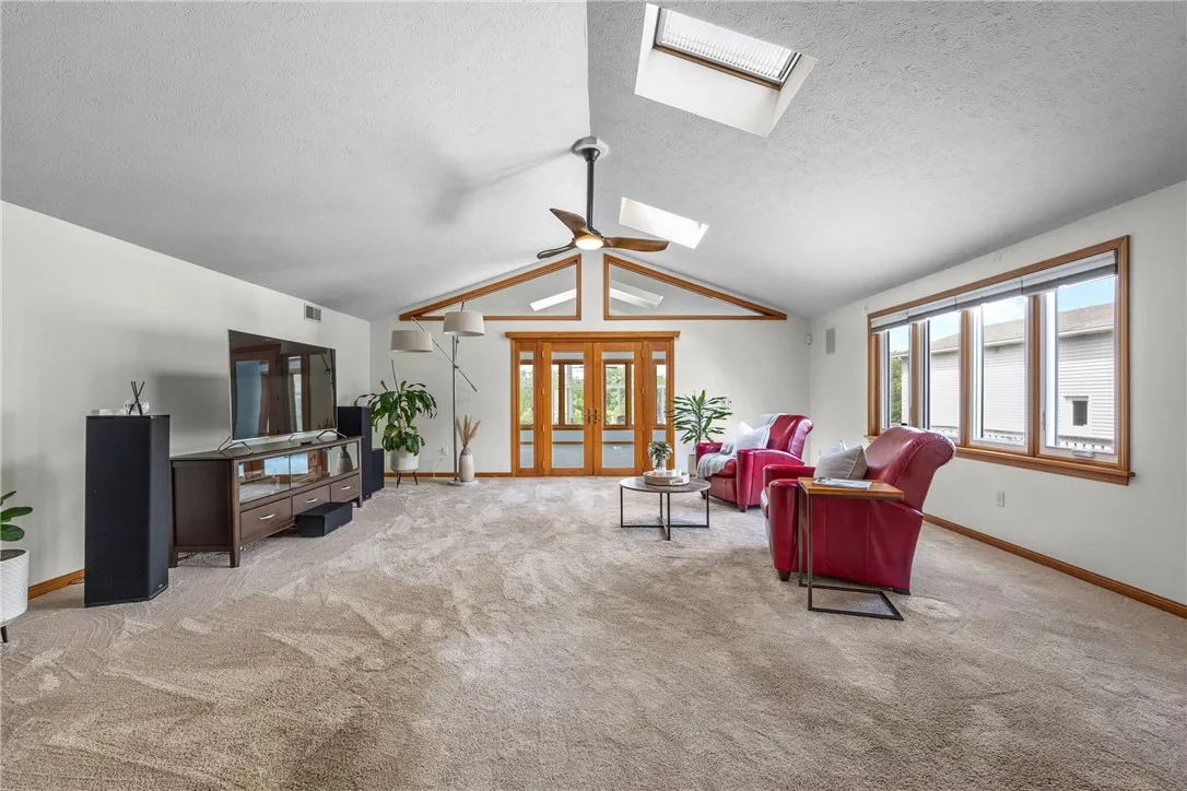 FAMILY ROOM FRENCH DOORS LEADS TO THE 4 SEASON SUN ROOM
