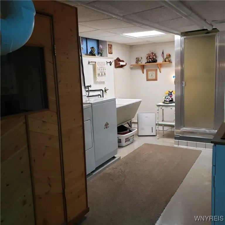 Sauna to the left of the washer & dryer