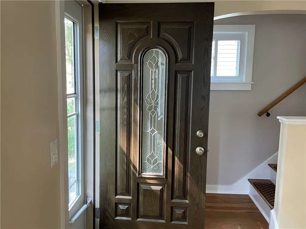 Fron't entry way with new door.