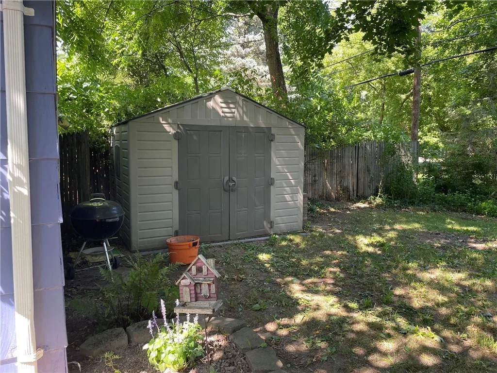 The shed gives you extra storage for lawn equiptment or toys!