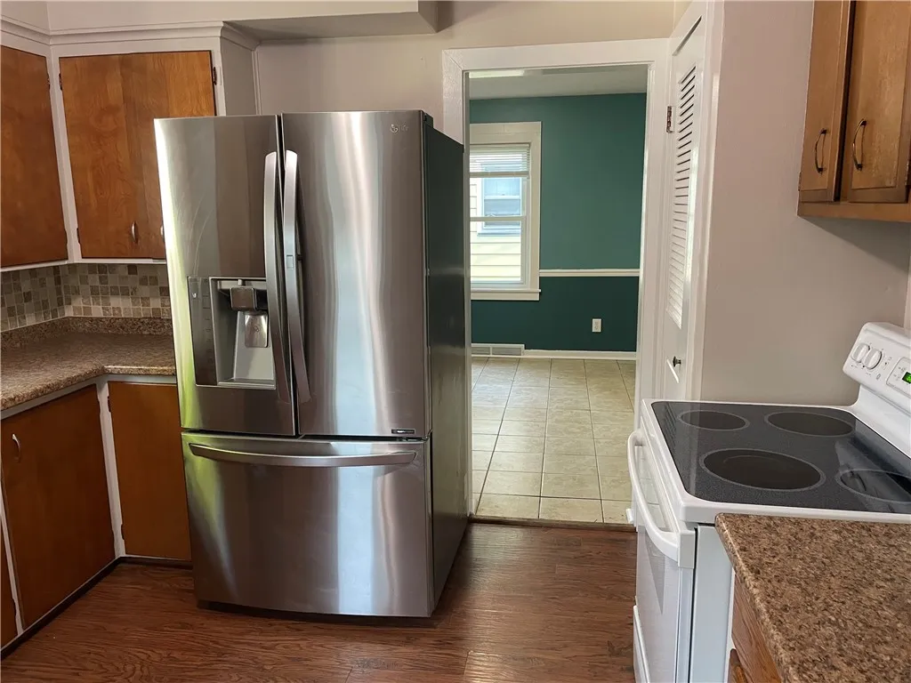 Newer refrigerator with lots of storage.