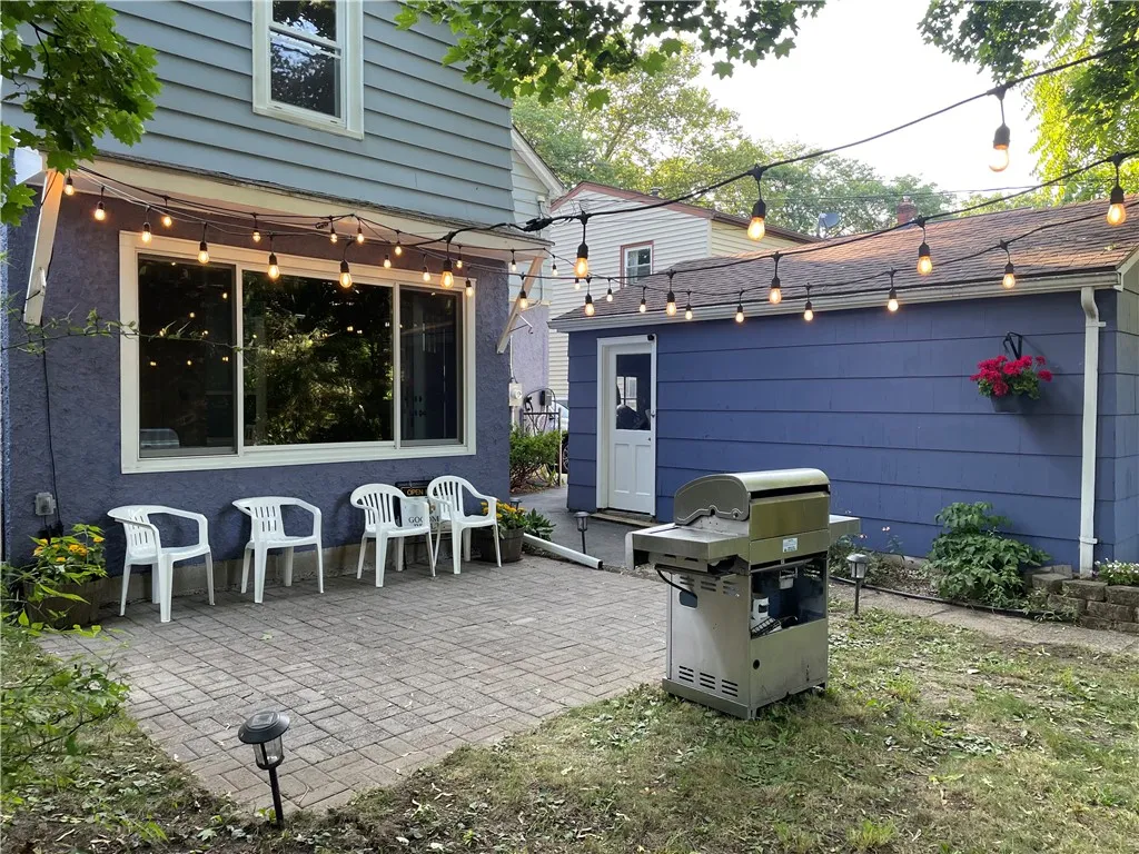 The garage shelters the patio, providing privacy to those enjoying the great outdoors.