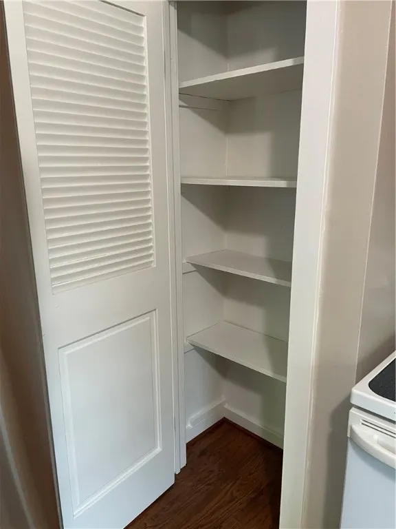 This pantry is located next to the stove.
