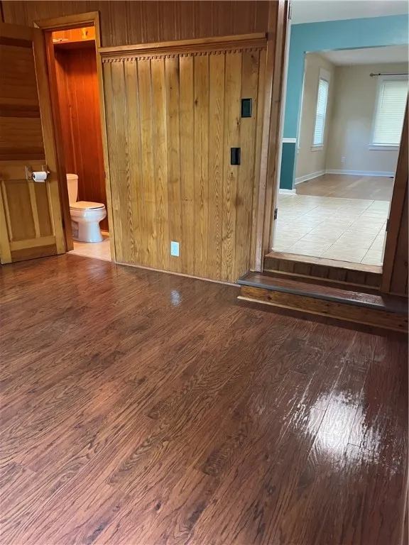A view of the 1/2 nath, and dining room, while standing in the familyroom.
