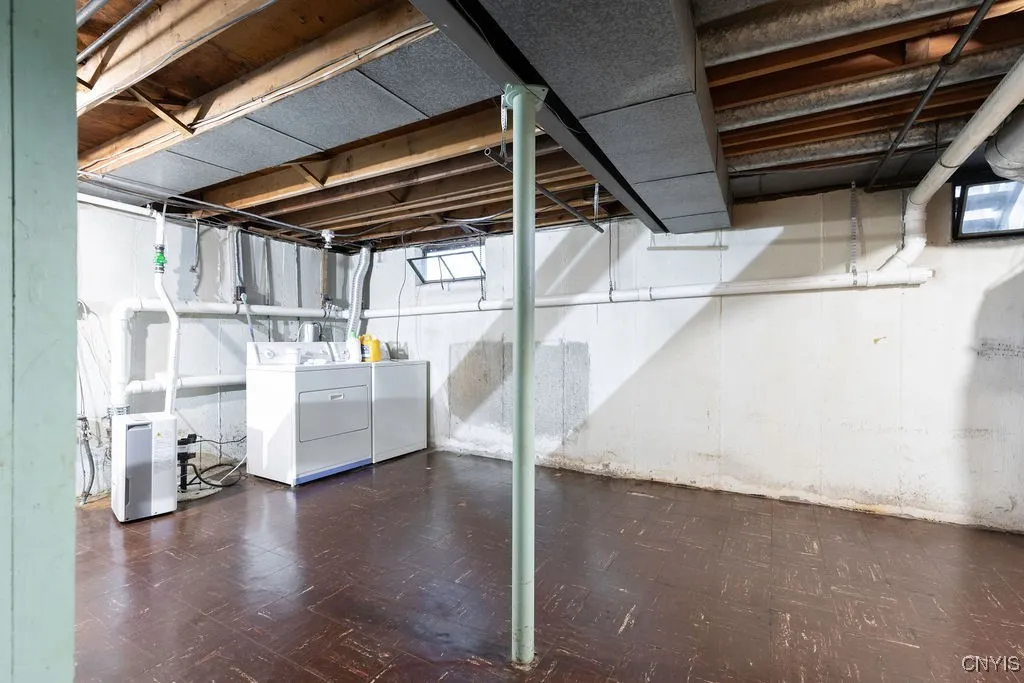 The basement offers ample storage space in addition to work shop space.