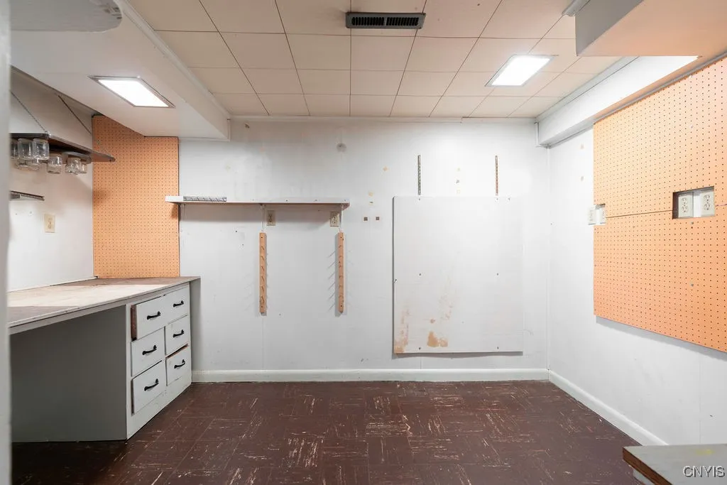 This storage and additional work shop area is just to the right of the 