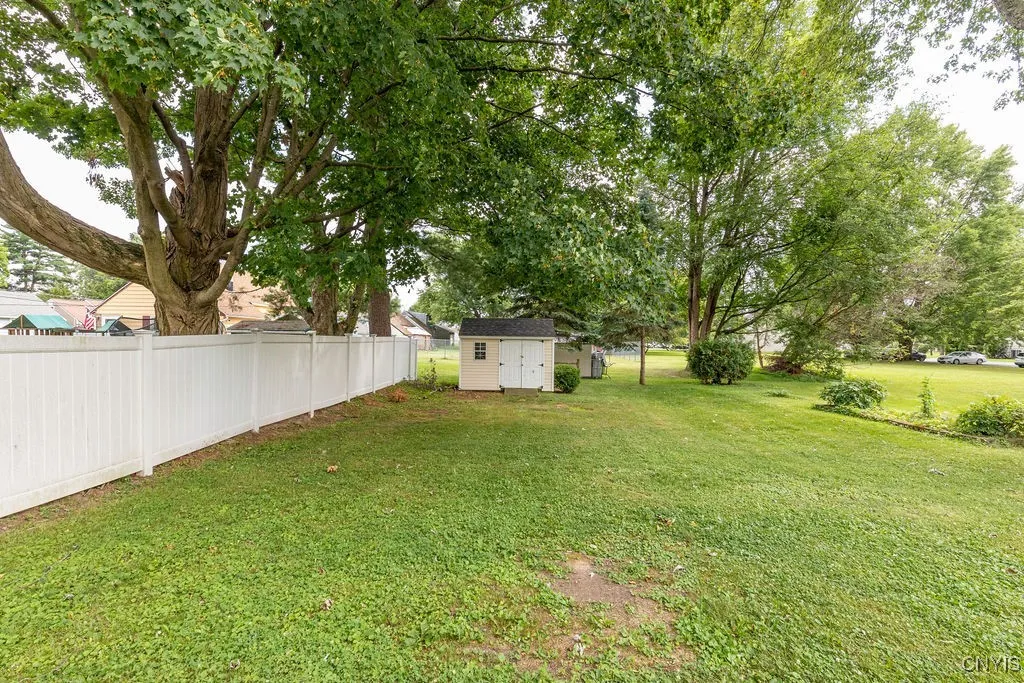The shed in the backyard has room to store lawn furniture, a lawn mower, or a snow blower in the off seasons.
