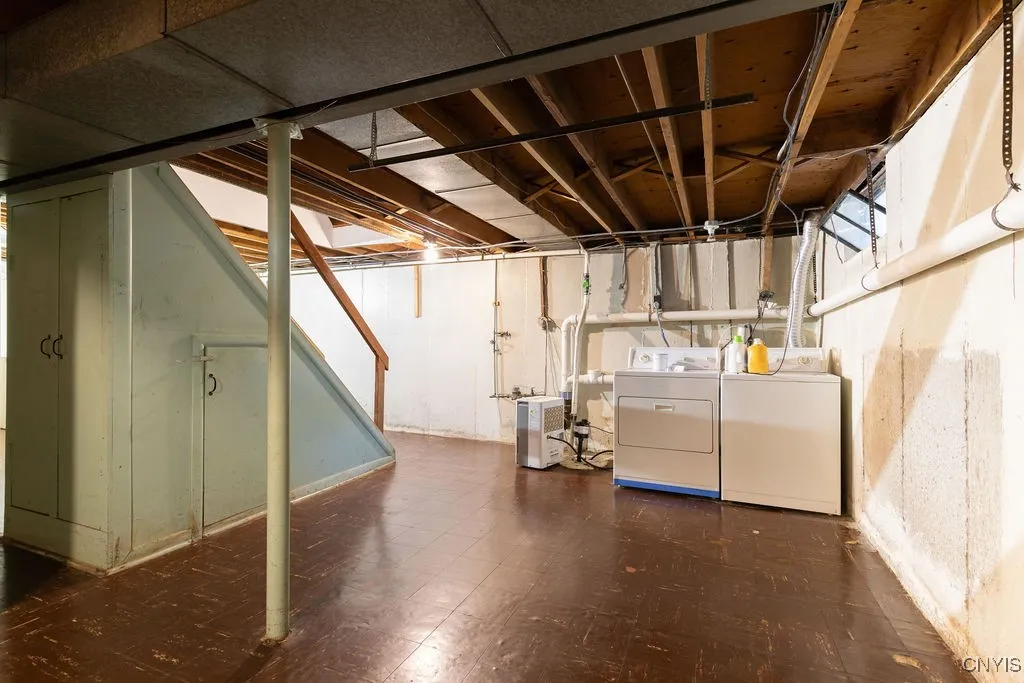 Basement laundry area and sump pump are located at the left front corner of the basement.