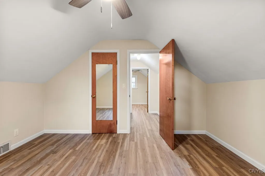 The second story of the home has two bedrooms. This bedroom is located at the top of the stairs, to the right.