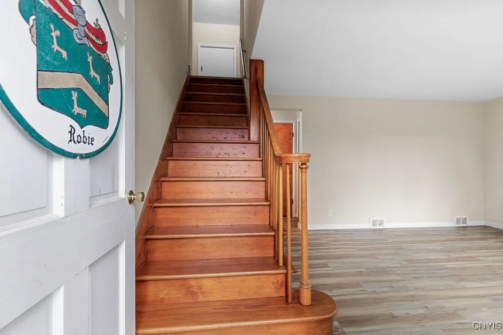 When entering this traditional Cape Cod home, the stairway is straight ahead and living room to the right of the stairs.