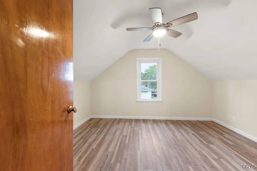 The luxury vinyl flooring and ceiling fan/light combination are new.