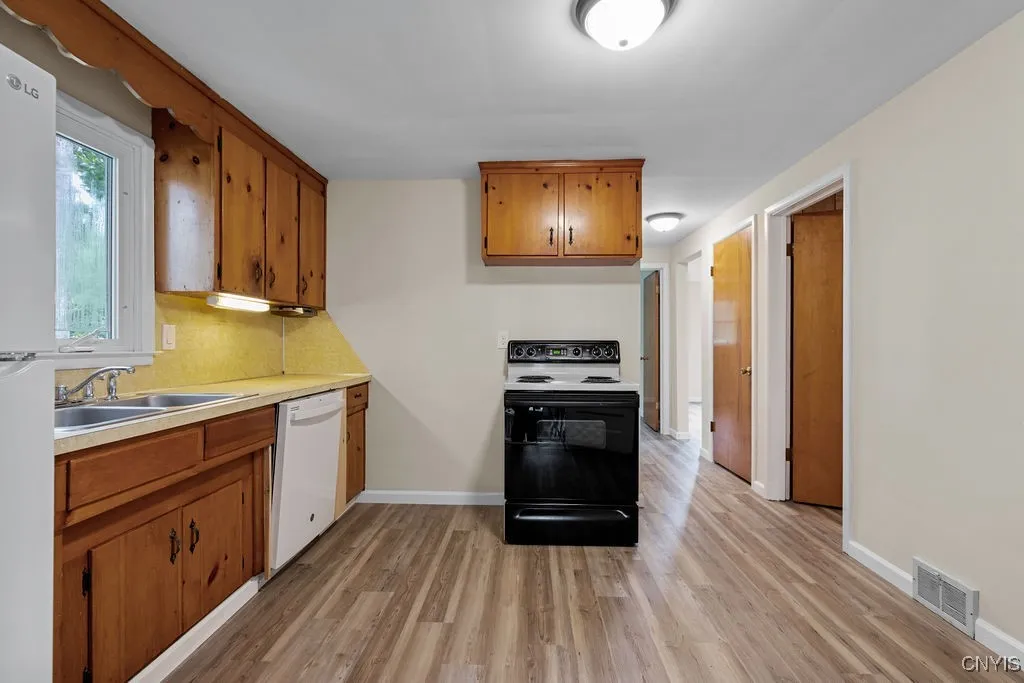 The flooring and light fixtures are new.  The stove, dishwasher, refrigerator, washer and dryer are all included with the purchase of the property.
