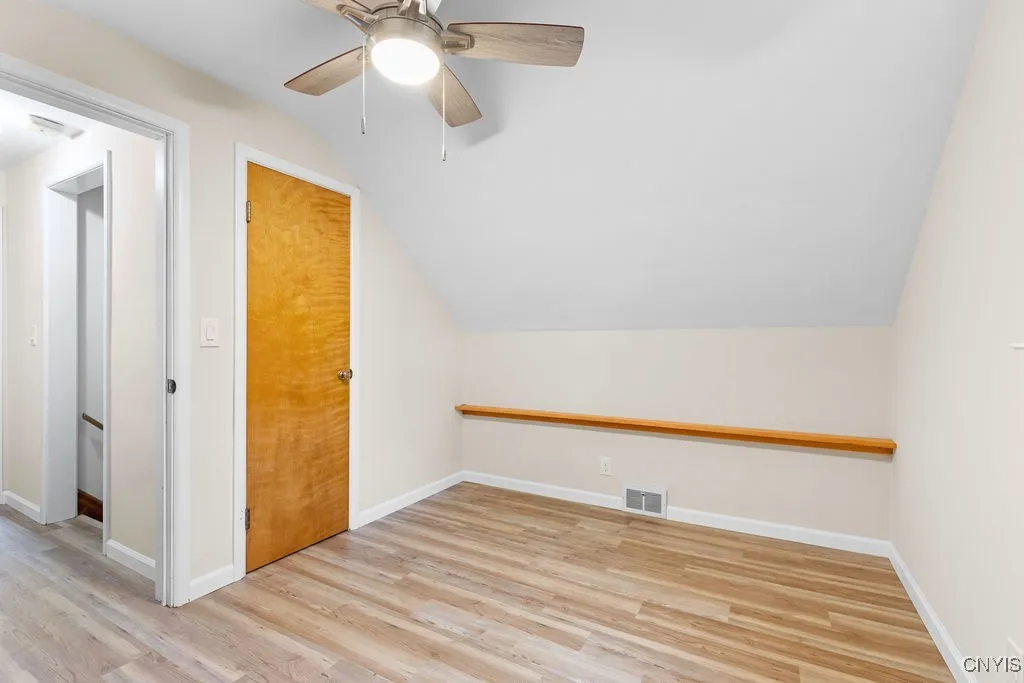 The fourth bedroom in the house is also located on the second floor, but to the left of the the stairs. It also features new luxury vinyl flooring and a new ceiling fan/light fixture.