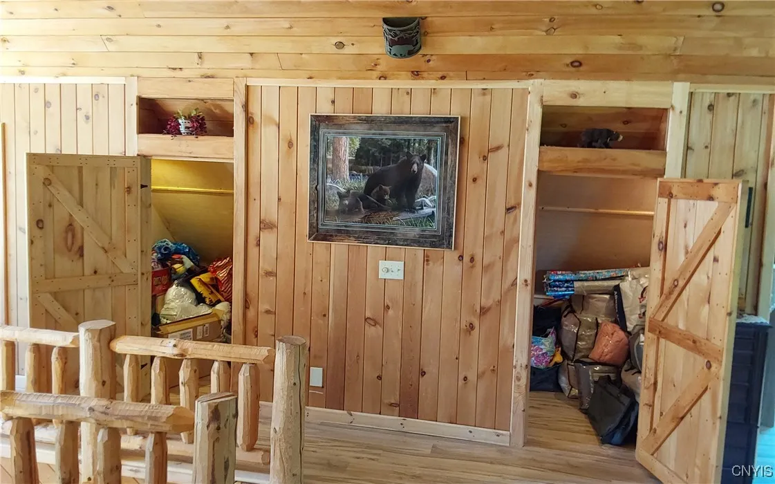 Upstairs loft area with a grand amount of storage on both sides
