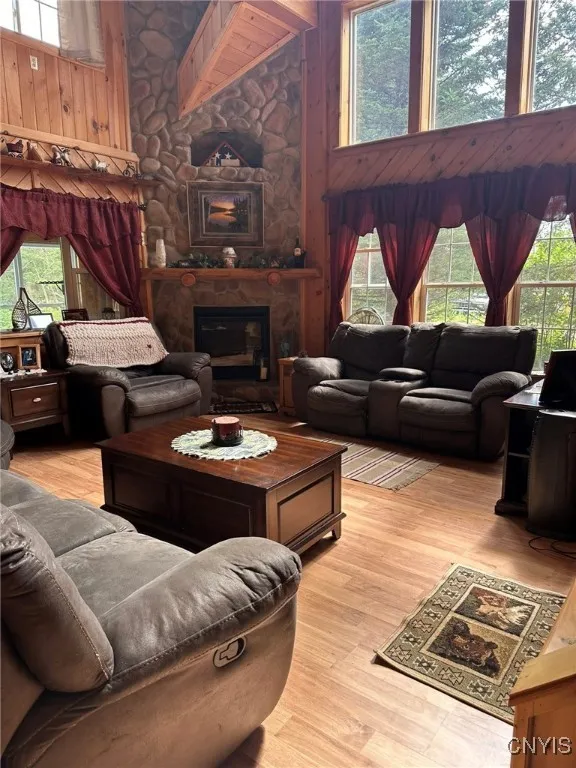 Living Room with floor to ceiling stone propane fireplace