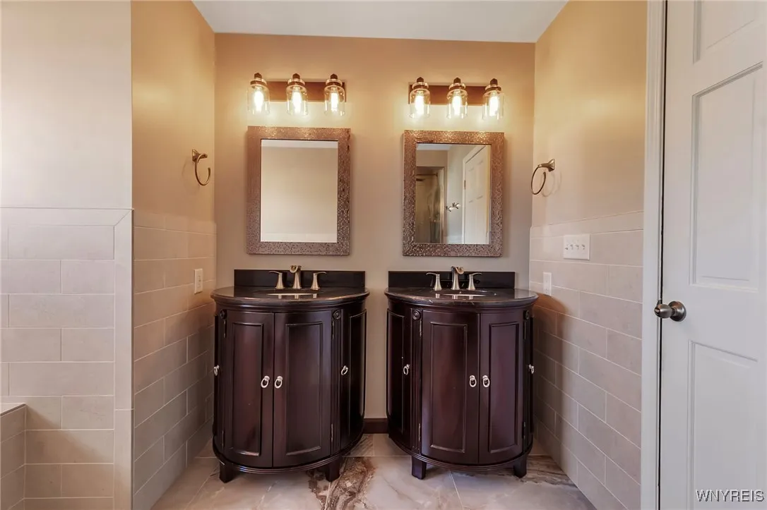 Primary Suite Bath has double vanities