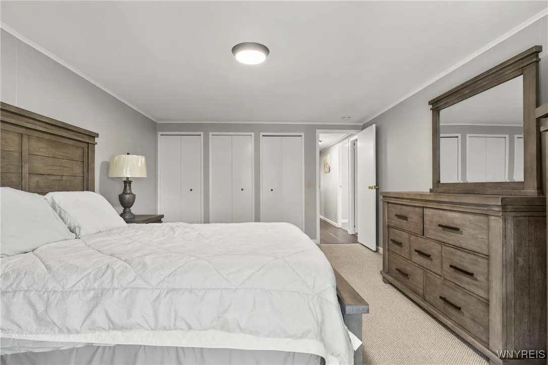 Primary Bedroom w/ Sliding Glass Doors Leading Out to Back Deck