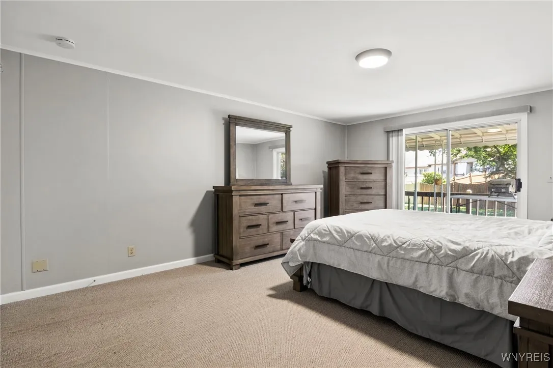 Primary Bedroom w/ Sliding Glass Doors Leading Out to Back Deck