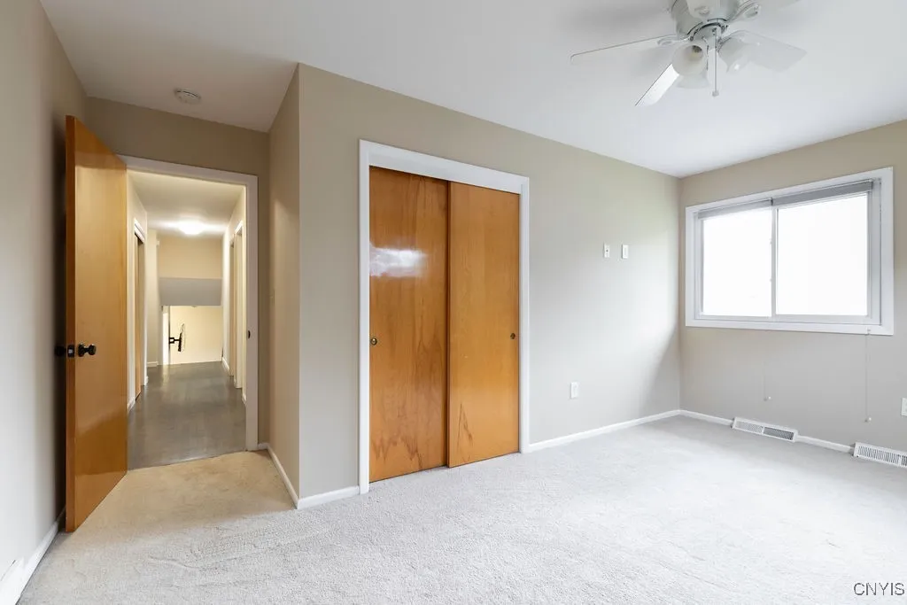 This corner bedroom is situated on the front, left hand side of the house, second story.  It has new carpeting and paint.