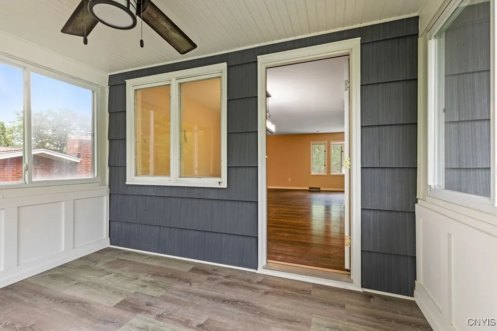 The sunporch provides fresh air on a rainy day and keeps the bugs away with its windows and screens.